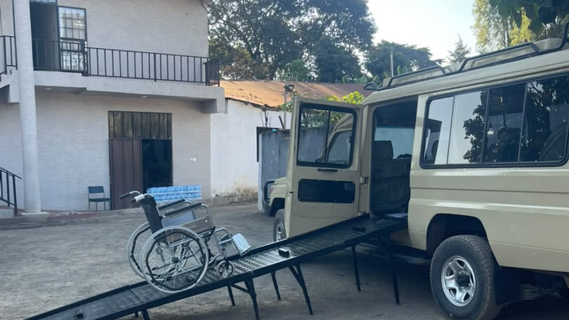 Wheelchair ramp deployed on an accessible safari Land Cruiser in Tanzania