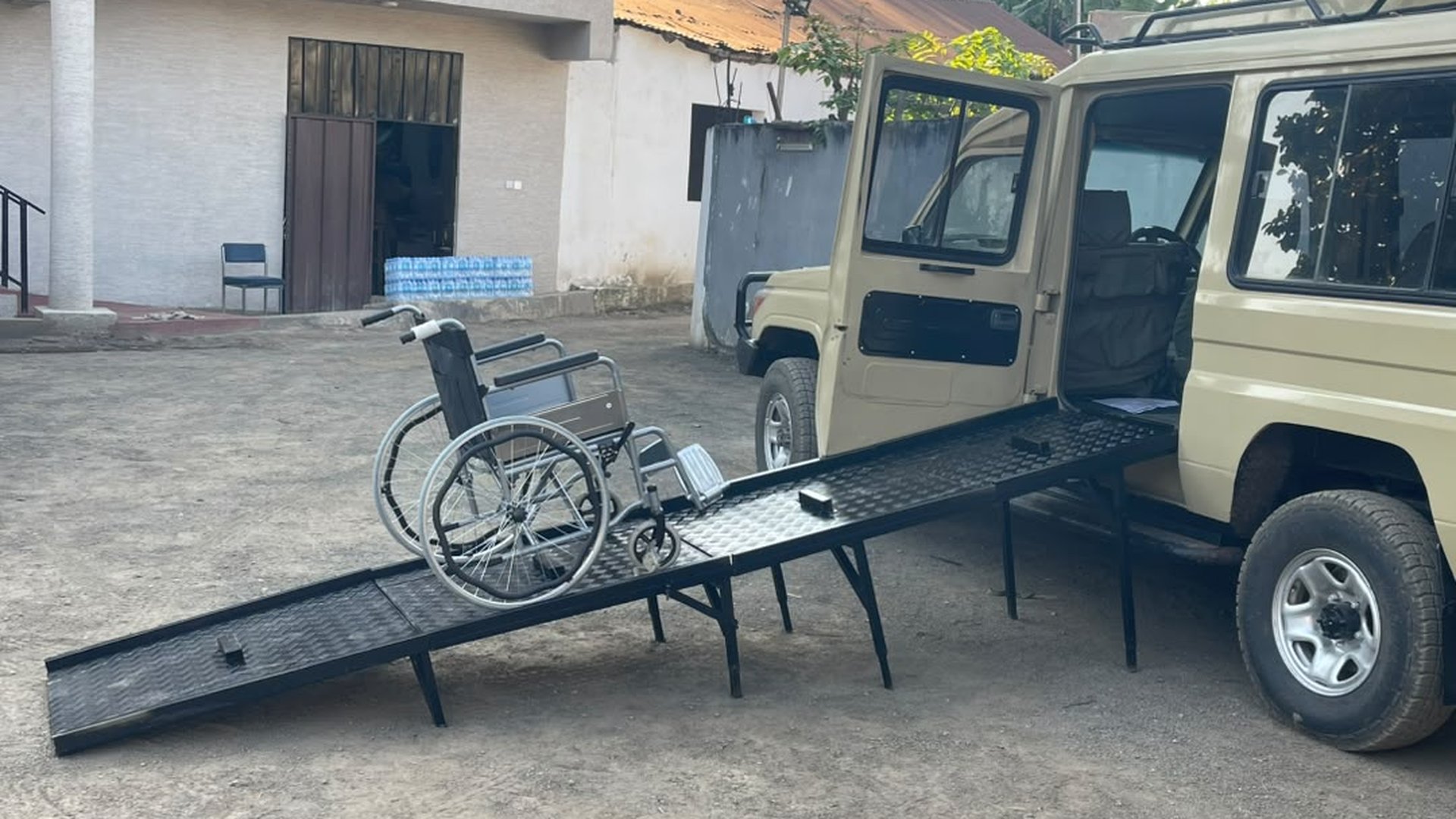 Wheelchair user boarding a safari vehicle by ramp